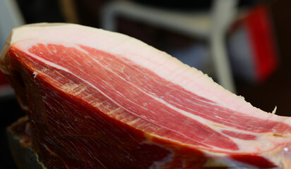 seasoned raw ham with sliced fat white lard in the delicatessen