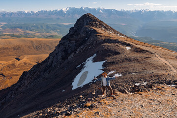 Aerial top view Man hiker on Aktash repeater on Altai mountains Russia