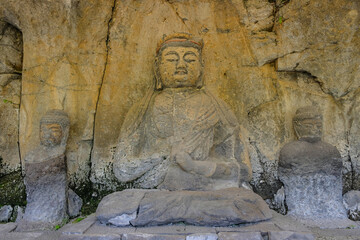 Fototapeta na wymiar The Usuki Stone Buddhas are a set of sculptures carved into rock during the 12th century in Usuki, Japan.