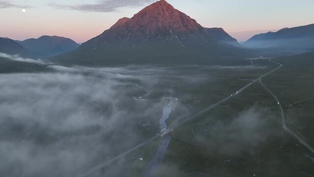 Buachaille Etive Mor and Rannoch Moor in Scottish Highlands. Aerial footage over River Coe 
