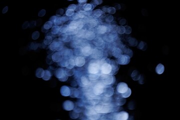 Blurred bokeh with sparkling water glitter with cool mist flash effect