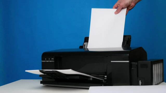 Front view of a printer and a blank sheet of A4 paper on a blue background.Printing equipment Generative AI