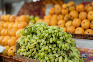 Green grapes at farmers market fresh fruits on the background
