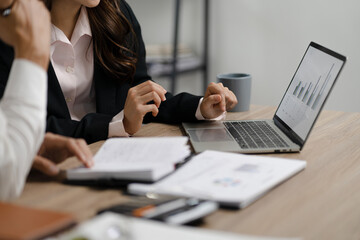 Business analyst calculating turnover figures in office..