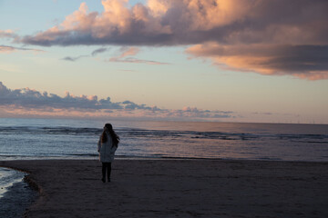 person walking on the beach