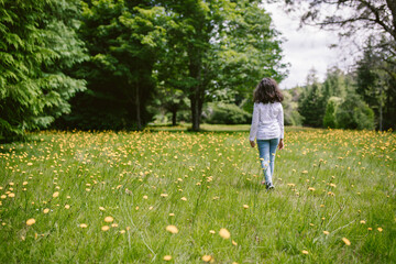 little girl walking in the park