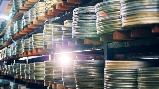 Film reels in cases storaged in video, cinema archive Generative AI