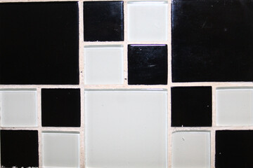 Texture in small and large geometric squares with predominance of black color..