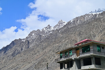 Snow Mountains Peak and Hotel at Naltar Valley in Northern Pakistan
