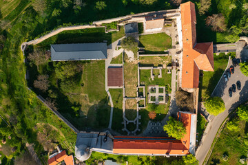 Aerial top down view about the castle of Pecsvarad. The building is a fortified monastery founded...