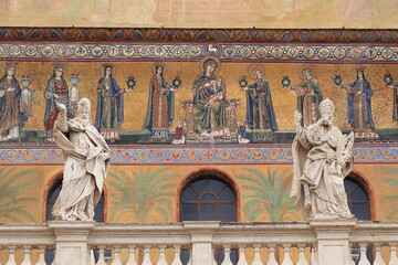 Fototapeta premium Santa Maria in Trastevere Church Exterior Close Up with Mosaic, Statues and Balustrade in Rome, Italy