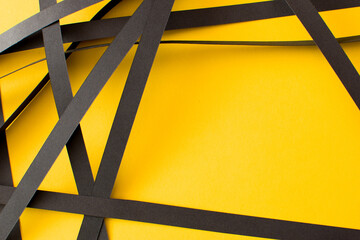 Yellow background with black geometric stripes, copy space