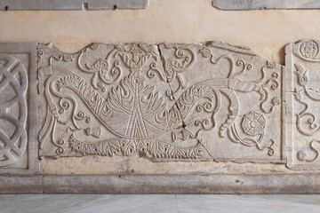Ancient Sculpted Tablet on the Portico Wall of the Santa Maria in Trastevere Basilica in Rome, Italy