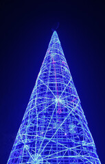 chrismast tree lights glowing agains black sky