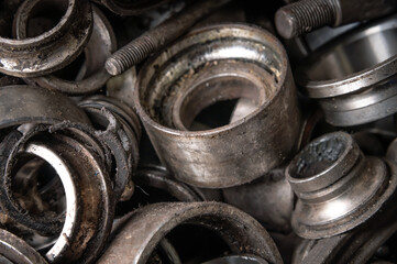 Obraz na płótnie Canvas Close-up in selective focus Old pieces of automotive bearings. Metal waste from the automotive industry
