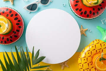 Summer fun vacation concept. Top view flat lay of pool float, cocktail glasses, palm leaves, sunglasses and starfish on blue and yellow background with empty circle for text or advert