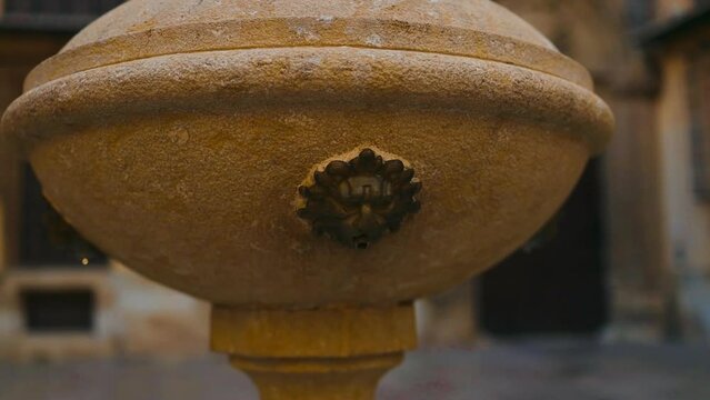 A fountain with a lion face in a square in Valencia, Spain. High quality photo Generative AI