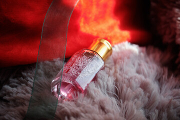 Women's perfume on a soft background. Gifts for women.