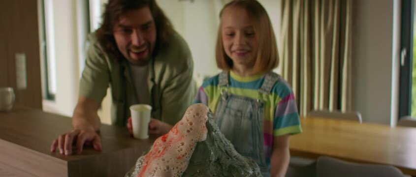 Father is helping his daughter to prepare a school science class volcano project, mixing vinegar and baking soda to imitate the eruption Generative AI