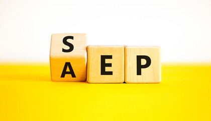 SEP or AEP symbol. Concept words AEP annual enrollment period SEP special enrollment period. Beautiful yellow table white background. Medical annual or special enrollment period concept. Copy space.