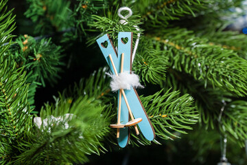 Russia. Kronstadt. January 19, 2023. Festive decoration toy - skis with sticks on the Christmas tree.