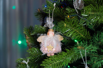 Russia. Kronstadt. January 19, 2023. Festive decoration in the form of a small angel on a Christmas tree.