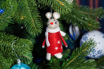 Russia. Kronstadt. January 19, 2023. Festive decoration - a mouse in a red coat on a Christmas tree.