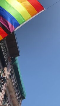 vertical format video Lgbt gay bisexual lesbian transgender nonbinary colored flags diversity lifestyle pride on balconies flags a sunny day spring summer concept symbol equality freedom rainbow