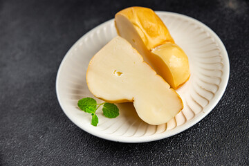 cheese scamorza smoked flavor food snack on the table copy space food background rustic top view