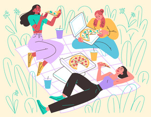 Girls in meadow on blanket eating pizza. Picnic, relaxing in nature