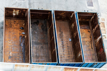 Four old rusty containers as abstract background