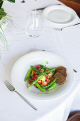Healthy food, seasonal spring salad, green asparagus, arugula, fresh and healthy vegetables and fruits, herbs, homemade salad.