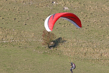 Paragliders flying from a hill	