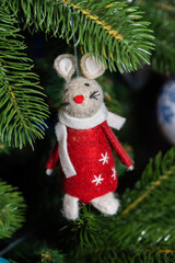 Russia. Kronstadt. January 19, 2023. Festive decoration - a mouse in a red coat on a Christmas tree.