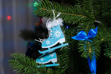 Russia. Kronstadt. January 19, 2023. Festive decoration - small blue skates on the Christmas tree.
