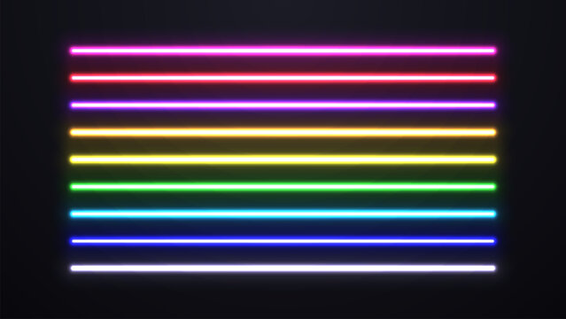 Bright multicolored lasers on a dark background. A set of neon lamps.