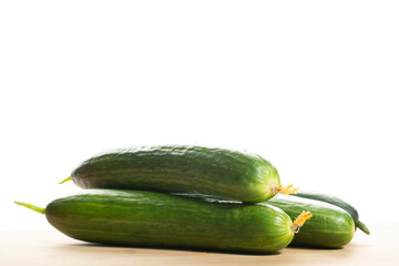 Cucumbers on a white background.Slicing cucumbers on a board.