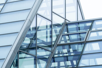 Metal structure supporting glass roof in shopping mall, office building or greenhouse. Modern building glass roof metal frame construction - Powered by Adobe