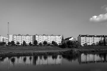 Residential houses on the Warta River in the city of Skwierzyna - obrazy, fototapety, plakaty