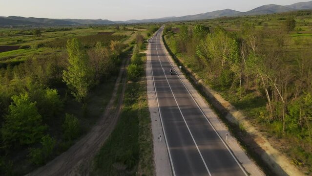 Motorcycle Ride And Car Drive On The Open Road In Sunny Day In Spring