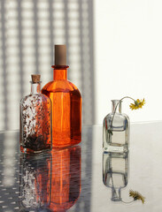Three vintage bottles and wildflower - 598426982