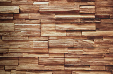 Beautiful wooden blocks wall with texture and rough surface in warm brown tone for background and decoration.