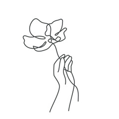 Beautiful flower in human hand.