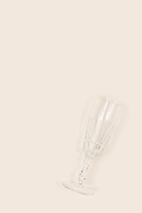Crystal glass on a beige background. Minimal composition.