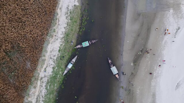 Rowing boat transporting passengers while drastic fall in Jamuna river water in Bangladesh's Balashighat, Gaibandha