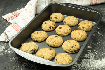 Cookies with chocolate on a baking sheet