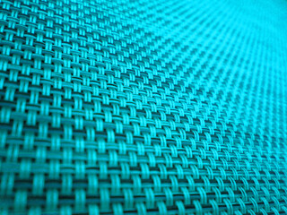 Abstract macro shot of an electric blue woven net 