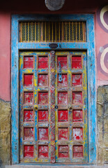 Fototapeta na wymiar View of old building with colorful door