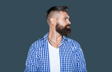 profile of bearded man wear checkered shirt on grey background
