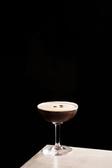 Espresso Martini cocktail boozy vodka, coffee liquor, espresso and syrup with coffee beans as...